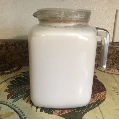 homemade almond milk in glass pitcher